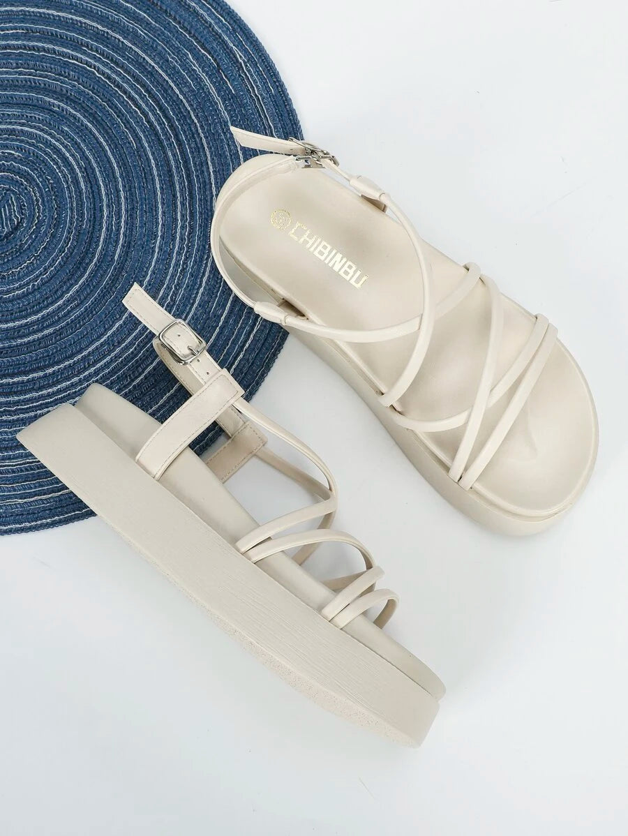 Black dressy flatform sandals close view with wide toe band braided strap and buckle