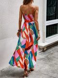 Rear view of multicolor spaghetti strap belted maxi dress with flowing skirt