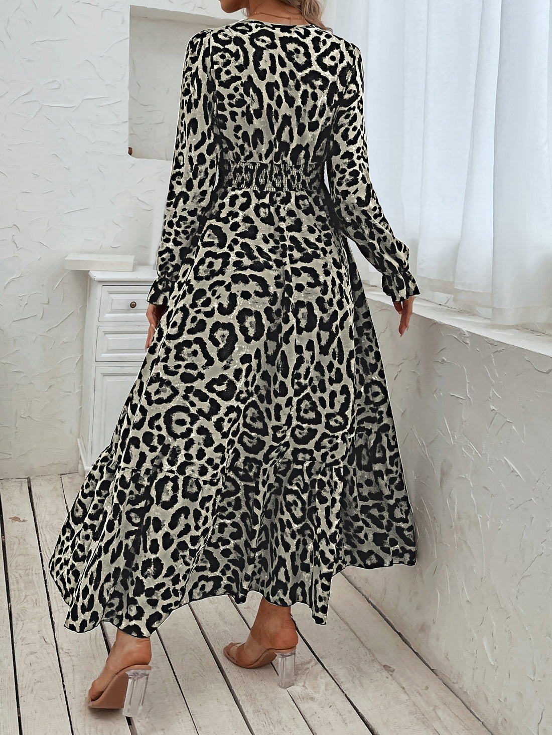 Elevate your style with our Wild Beauty Leopard Print Flounce Sleeve Shirred Dress. Crafted from lightweight, flowy fabric, this dress features trendy leopard print and flounce sleeves for a bold and fashion-forward look. The shirred waistline adds a flattering touch, making it perfect for any occasion.