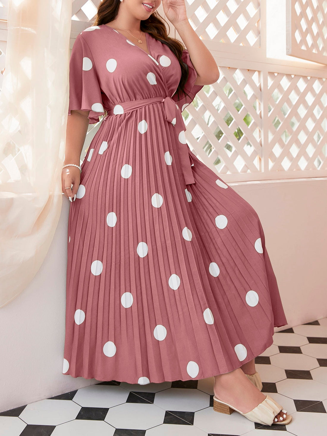 Embrace summer with this playful polka dot dress designed for plus size comfort! The butterfly sleeves add a flirty touch while the pleated design creates a flattering silhouette. The included belt cinches your waist for that perfect hourglass shape. Slip into effortless style for picnics, brunches, or casual outings - this dress does all the fashion work for you!