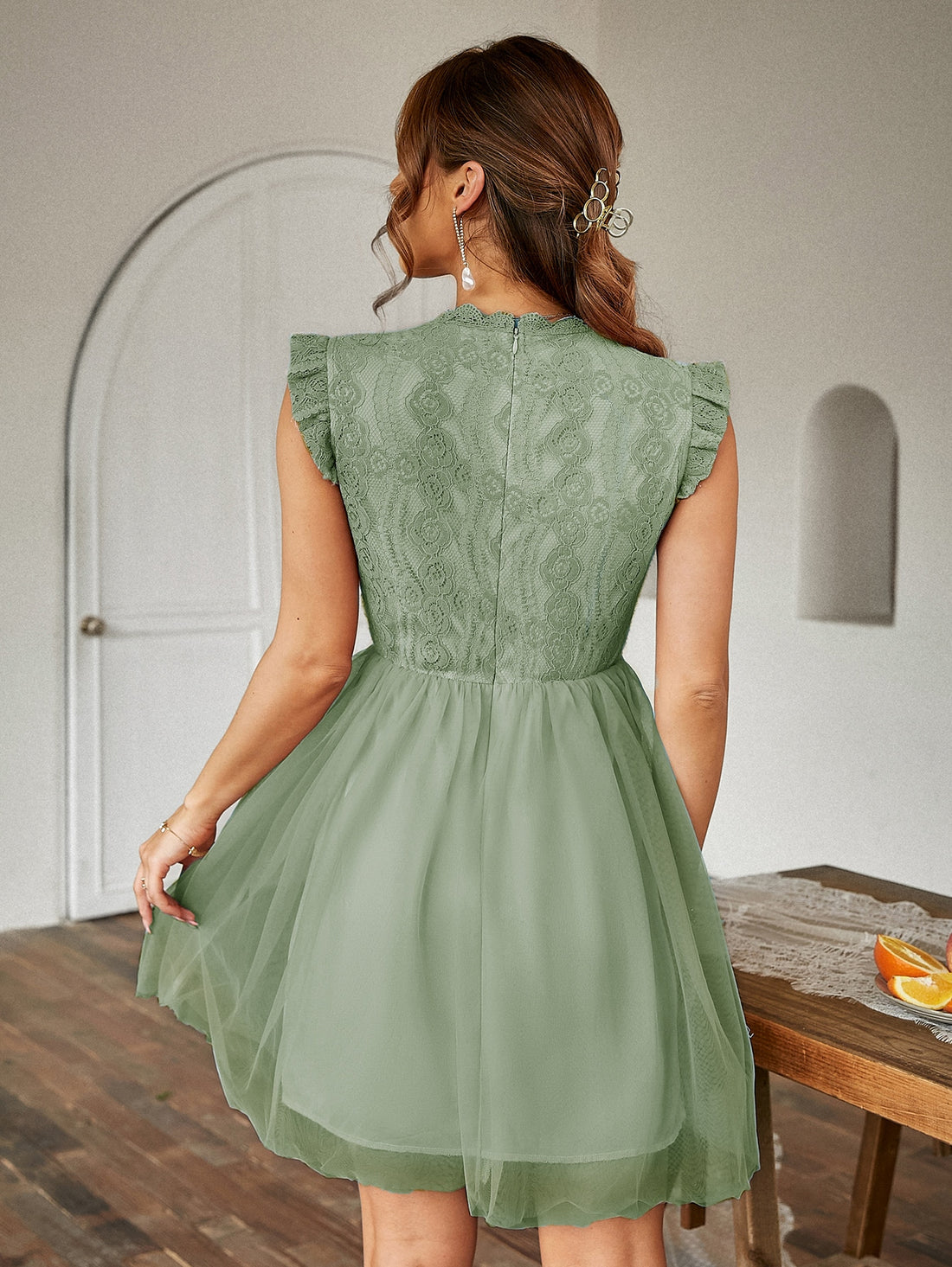 Dress to impress with our Chic and Elegant: Contrast Lace Ruffle Scallop Trim Mesh Dress. The intricate lace and ruffle detailing adds a touch of romance, while the contrasting colors create a bold and modern look. Made with high-quality mesh fabric, this dress will make you stand out in any event.