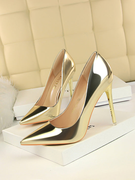 Elevate your party attire with our Gleaming Gold Metallic Stiletto Court Pumps. These stunning heels feature a metallic finish that adds a touch of glamour to any outfit. The stiletto heel provides the perfect amount of height for a leg-lengthening effect. Perfect for party nights, these pumps will make you stand out in style.