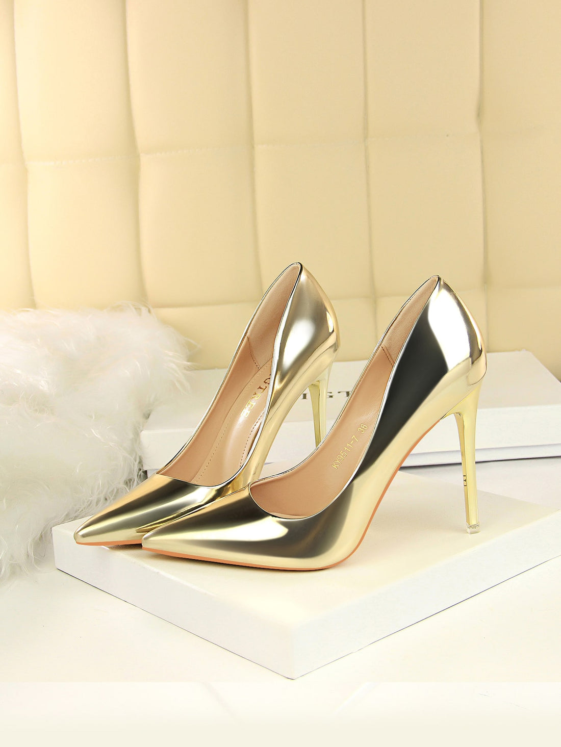 Elevate your party attire with our Gleaming Gold Metallic Stiletto Court Pumps. These stunning heels feature a metallic finish that adds a touch of glamour to any outfit. The stiletto heel provides the perfect amount of height for a leg-lengthening effect. Perfect for party nights, these pumps will make you stand out in style.