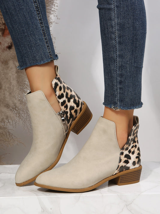 Stay stylish and on-trend with our Beige Leopard Print Chunky Heeled Booties. These sleek and comfortable short boots are perfect for any occasion. The chunky heel provides both stability and a fashionable touch, while the leopard print adds a touch of sass. Elevate any outfit with these must-have booties.