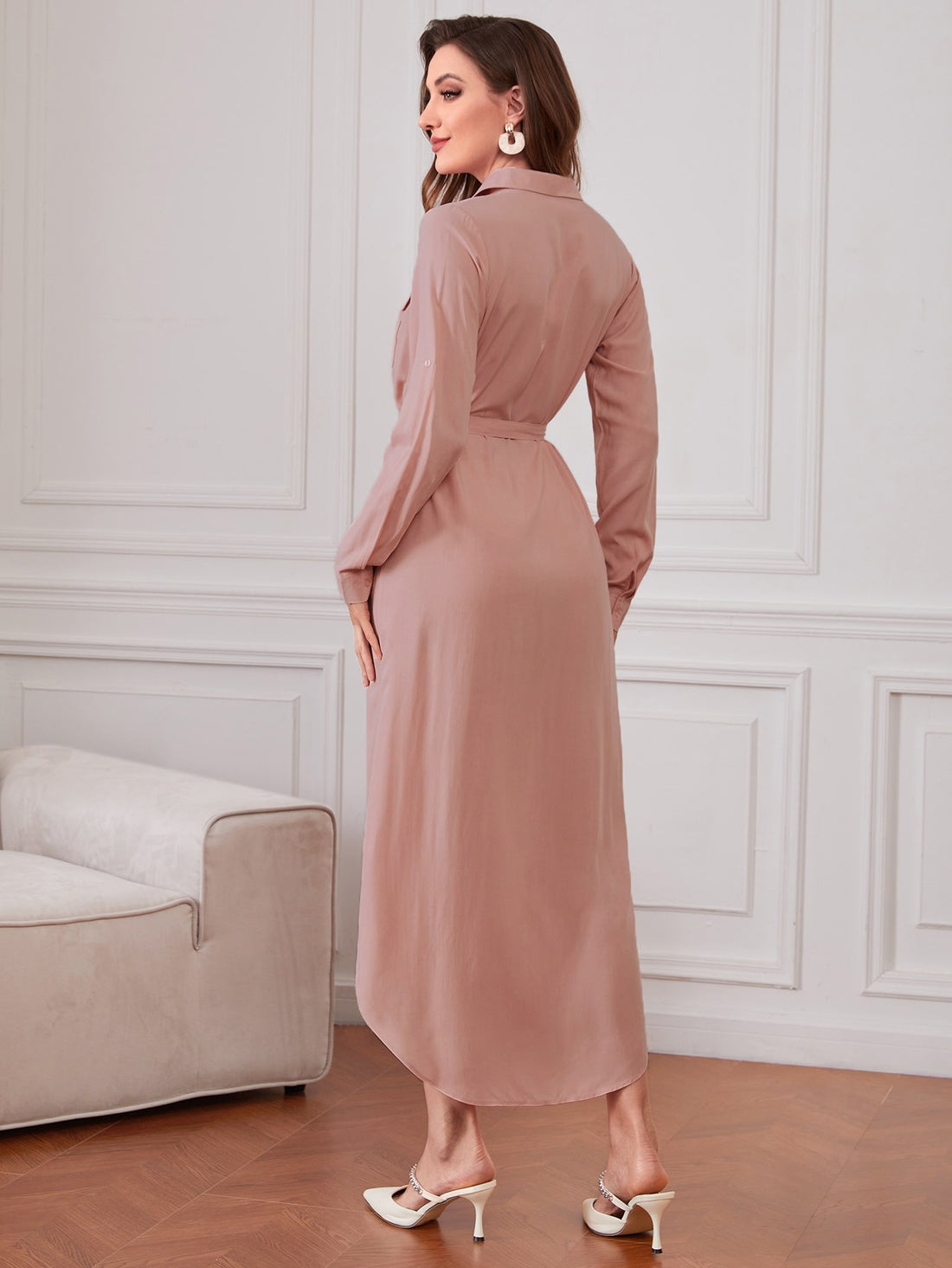 Elevate your wardrobe with our Chic and Versatile Belted Shirt Dress. Roll-up sleeves give a relaxed look while the belted waist accentuates your figure. Perfect for any occasion, this dress is both stylish and comfortable. Get ready to turn heads and make a statement with this must-have piece.