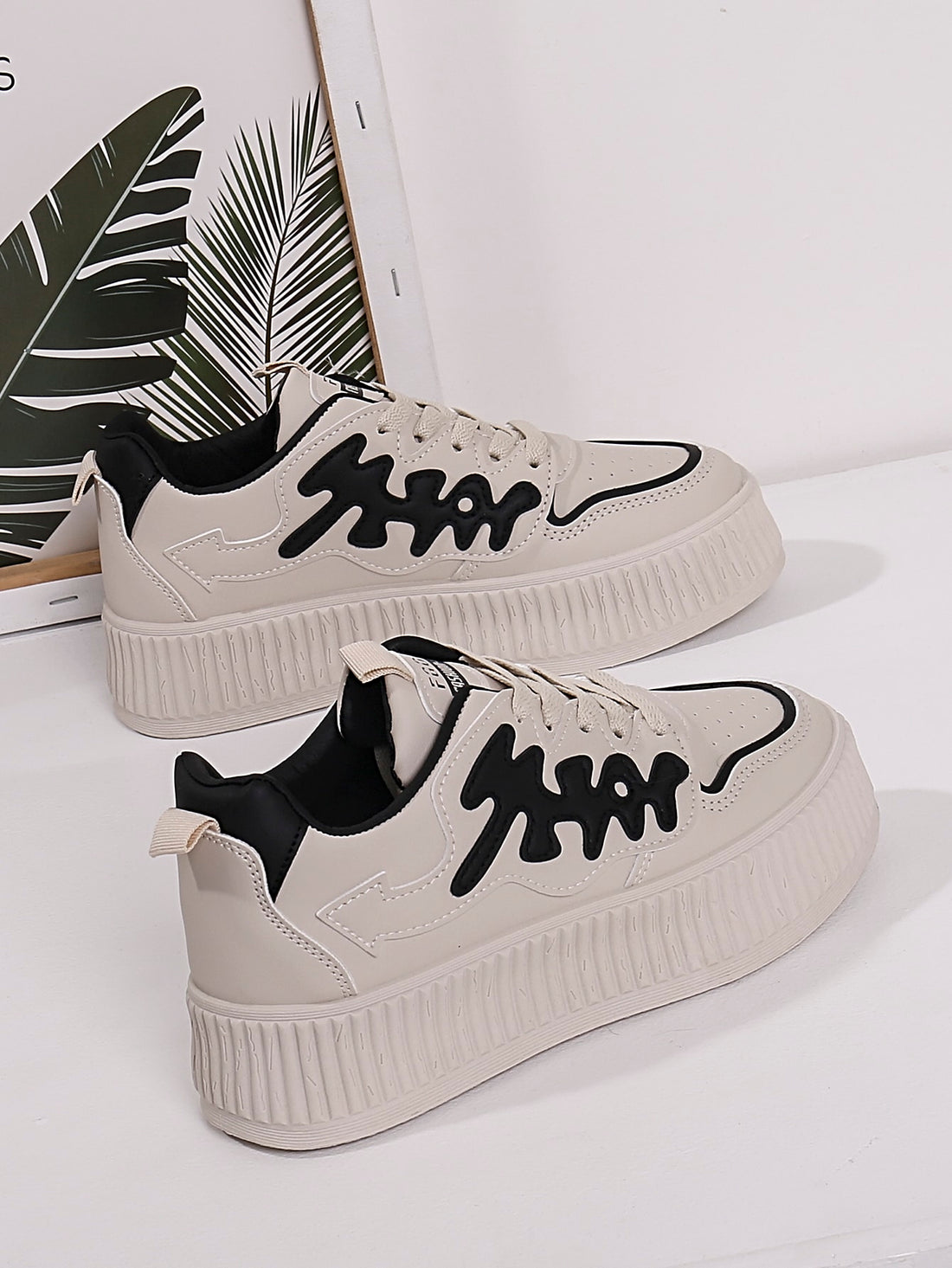 Elevate your style with Sporty Chic: Beige Letter Graphic Lace-up <a href="https://canaryhouze.com/collections/women-canvas-shoes" target="_blank" rel="noopener">Sneakers</a> for Women. Designed for comfort and fashion, these sneakers feature a unique lace-up design and eye-catching letter graphics. Perfect for any athletic or casual look, these sneakers are sure to make a statement while providing exceptional support.