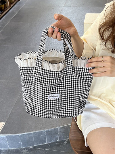 Stay stylish and organized for the school year with our Ruffle Trim Square Bag. The perfect essential for any student, it features a trendy ruffle trim design and spacious square shape, providing both fashion and functionality. Keep all your essentials in one stylish place.
