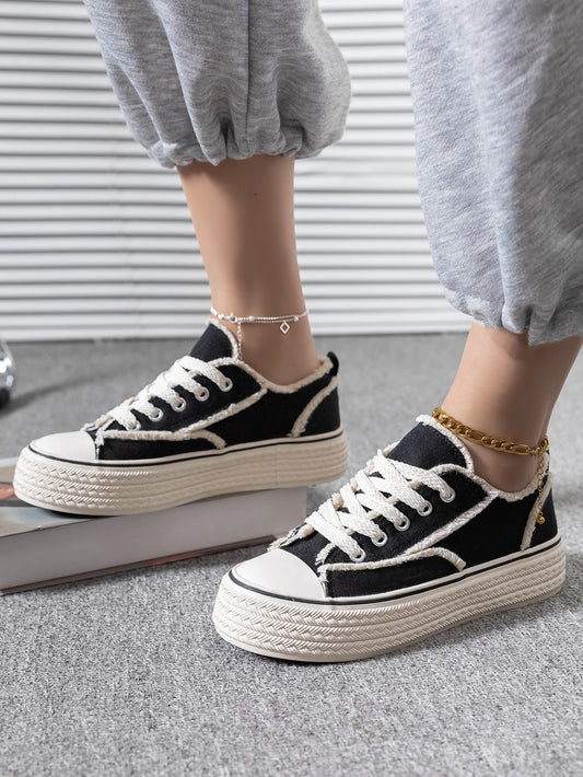 These Black Slip-Resistant Canvas <a href="https://canaryhouze.com/collections/women-canvas-shoes?sort_by=created-descending" target="_blank" rel="noopener">Sneakers</a> are perfect for spring and autumn. With a stylish black color, they combine fashion and functionality. The slip-resistant design ensures safety while the canvas material provides comfort. Elevate your footwear game without compromising on practicality.