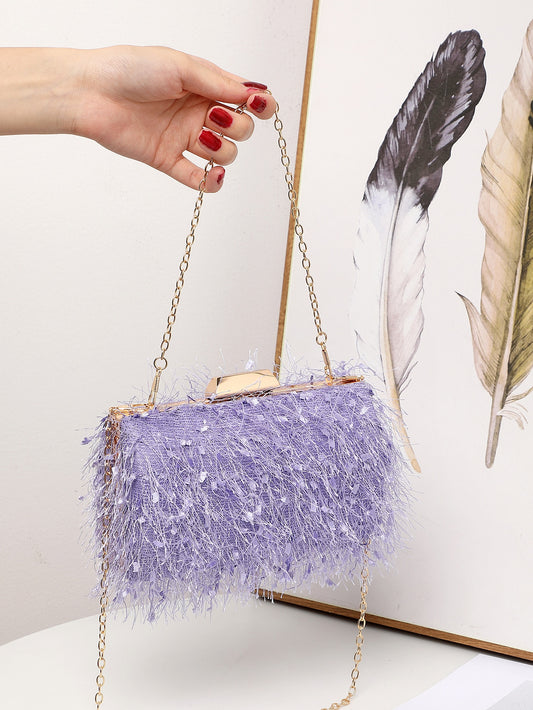 Elevate your fashion game with our Glamorous Fuzzy Fluffy Chain Box Bag. This statement piece is the perfect accessory for any event, adding a touch of glamour and sophistication to your look. Crafted with a soft, fuzzy material and finished with a chic chain, this bag will be your go-to for a touch of luxury.