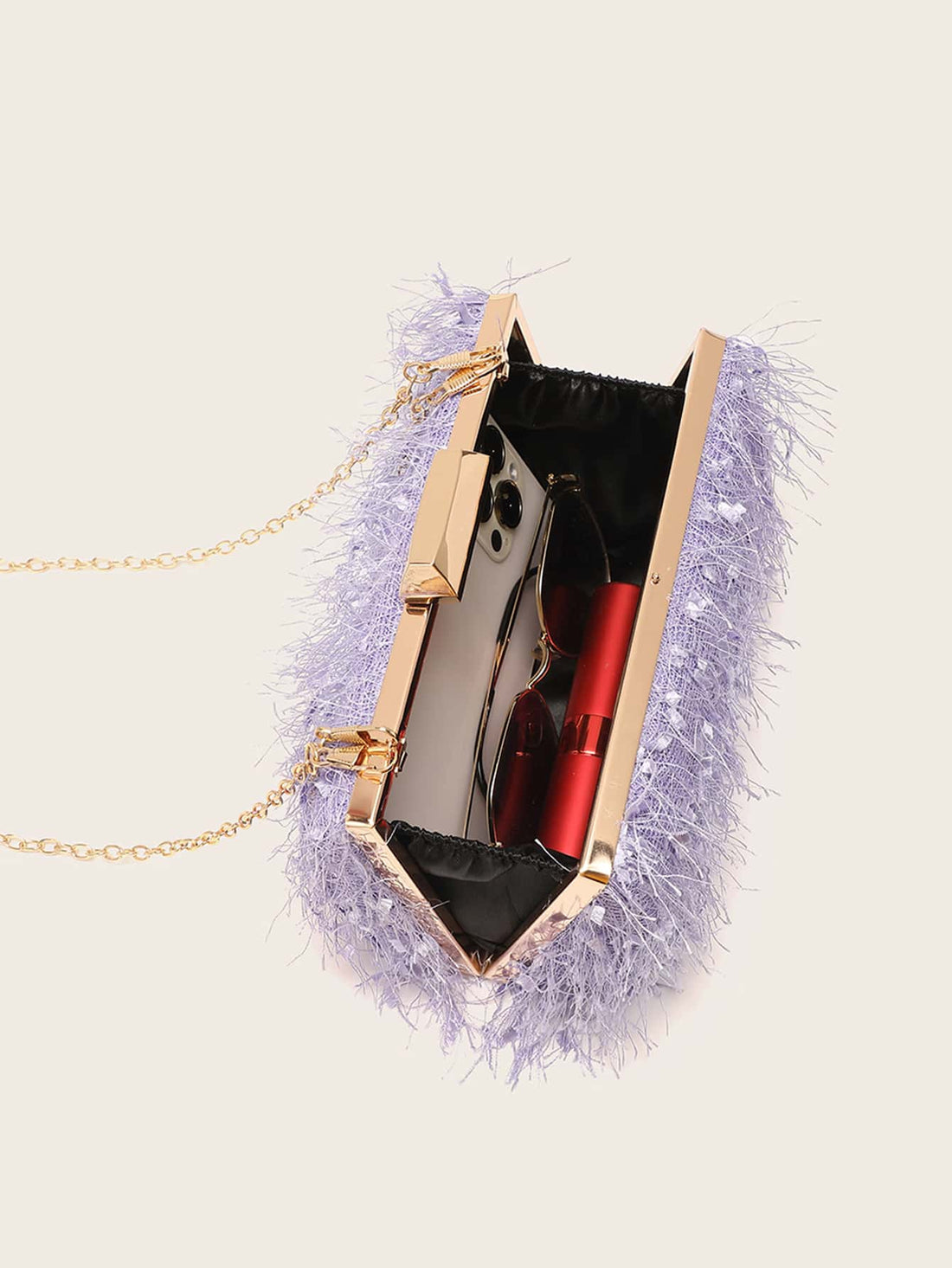 Elevate your fashion game with our Glamorous Fuzzy Fluffy Chain Box Bag. This statement piece is the perfect accessory for any event, adding a touch of glamour and sophistication to your look. Crafted with a soft, fuzzy material and finished with a chic chain, this bag will be your go-to for a touch of luxury.