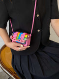 Front angle of hot pink mini square crossbody bag with chain strap