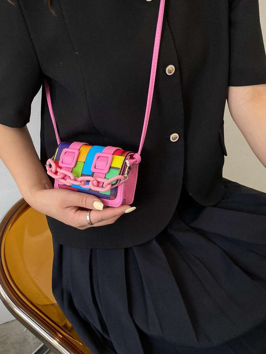 Front angle of hot pink mini square crossbody bag with chain strap