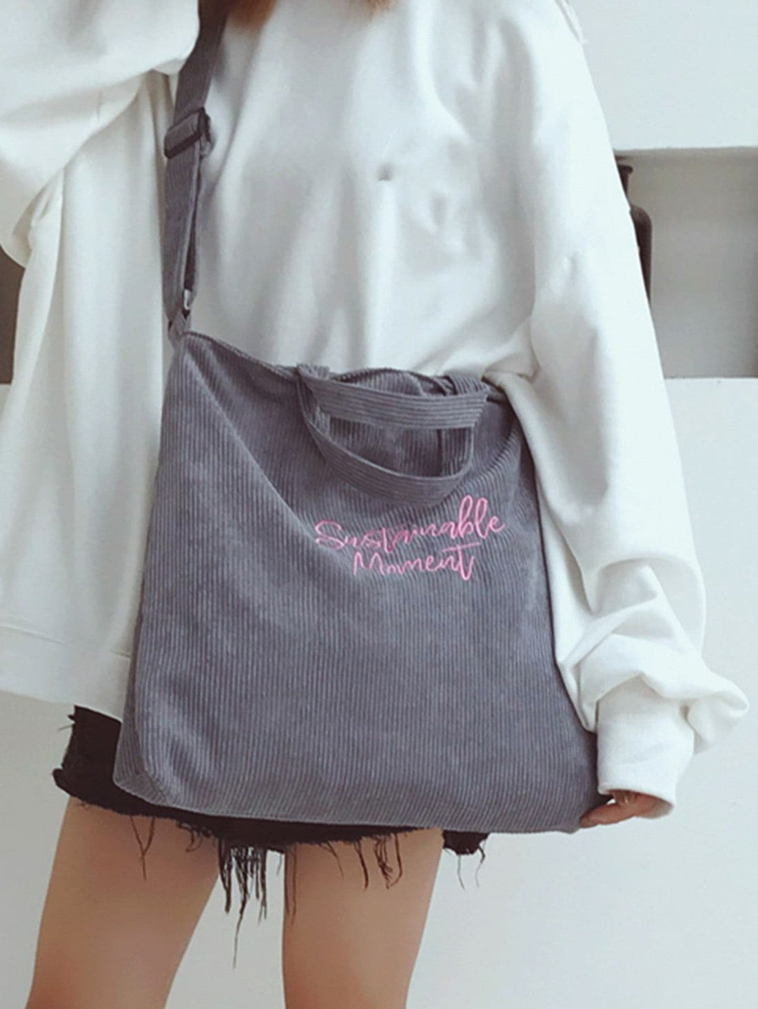 Introducing Retro Charm, the stylish tote bag for all your shopping needs. Made from lightweight vintage corduroy, this bag features a unique letter print design that adds a touch of retro charm to any outfit. Stay stylish and organized while shopping with this one-of-a-kind tote.