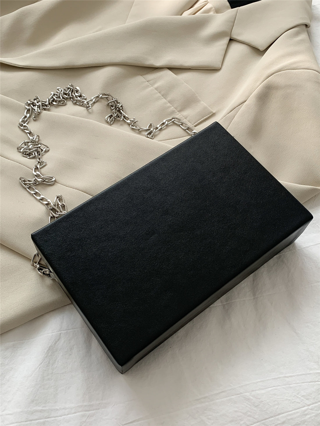 Introducing our Retro Music Cassette Tape Design Crossbody Bag with Metal Chain - the perfect statement piece for music lovers! With a vintage-inspired design and durable metal chain, this bag adds a stylish touch to any outfit. Carry your essentials in style and make a unique fashion statement with our versatile and eye-catching crossbody bag
