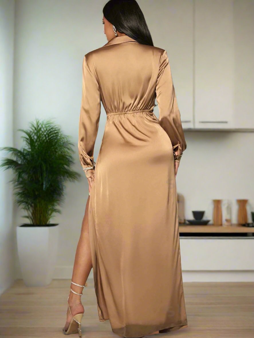 This stunning dress exudes elegance with its wrap silhouette, satin fabric, and sparkling rhinestone accents. The perfect choice for a special occasion, it will make you feel radiant and confident. The luxurious fabric drapes beautifully, creating a flattering and sophisticated look. Elevate your style with this timeless and glamorous piece.