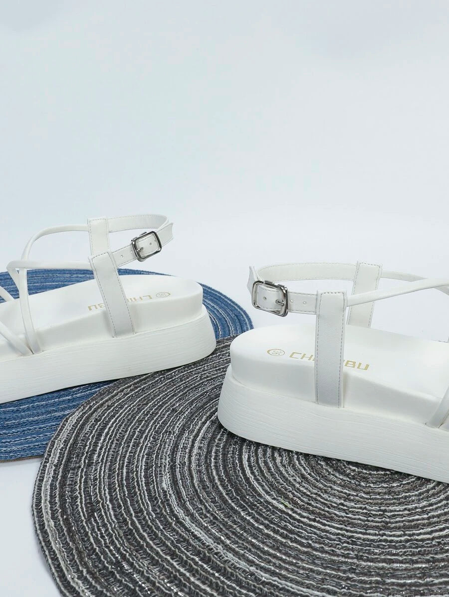 Black chunky sole sandals product view showing textured horizontal sidewall and footbed