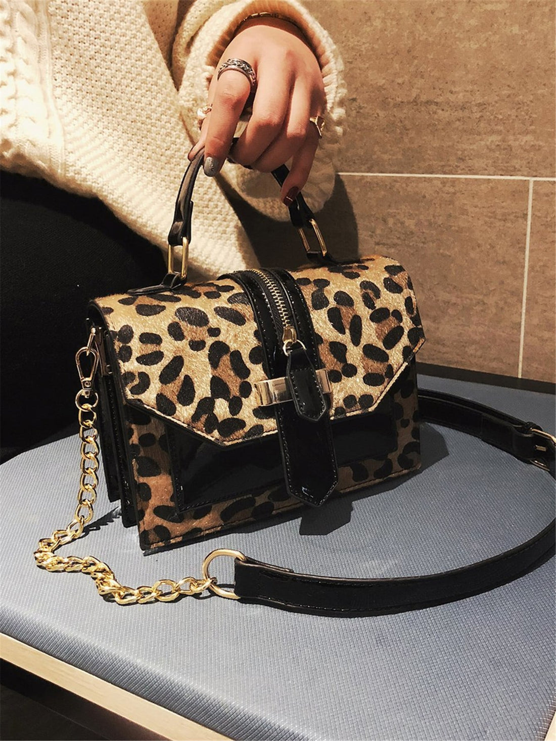 Introducing our Leopard Print Chain Flap Square Bag, the ultimate must-have accessory for on-the-go women. Featuring a trendy leopard print and a chic chain strap, this bag will elevate any outfit. Stay stylish and organized with this versatile and fashionable bag.