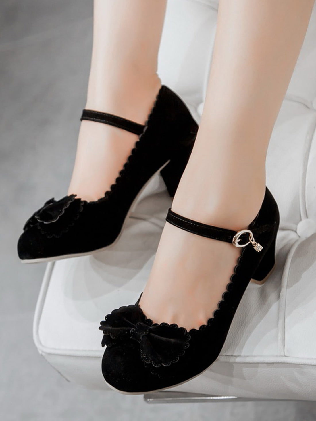 The Black Bow Decor Mary Jane Pumps combine style with comfort, featuring a scalloped trim and chunky heel. Expertly crafted, these pumps offer both elegance and support to your outfit. Elevate your look with these timeless and versatile shoes.