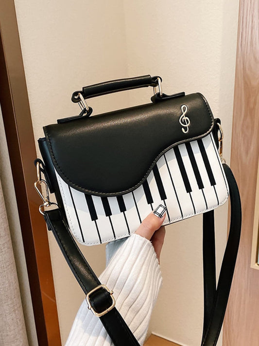 Introducing the Melody of Chic: Mini Piano Key Flap Square Bag for Women - the perfect accessory for music lovers. This stylish bag features a unique piano key flap and a square shape, making it both functional and fashionable. Carry your essentials in style with this elegant bag.