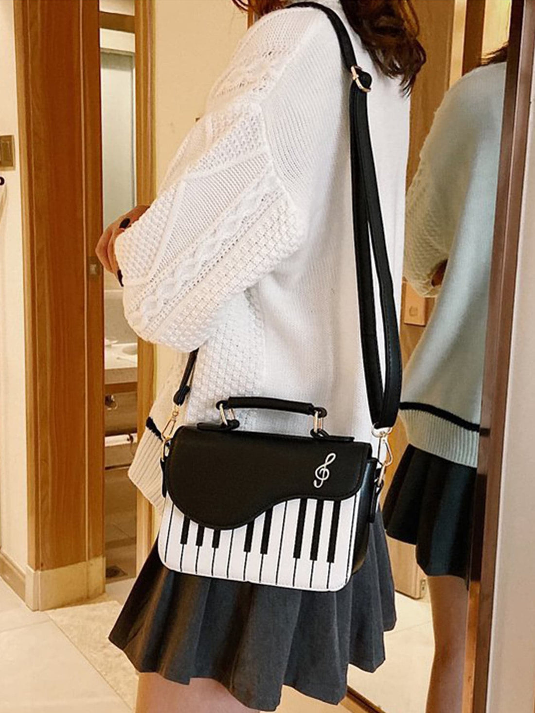 Introducing the Melody of Chic: Mini Piano Key Flap Square Bag for Women - the perfect accessory for music lovers. This stylish bag features a unique piano key flap and a square shape, making it both functional and fashionable. Carry your essentials in style with this elegant bag.
