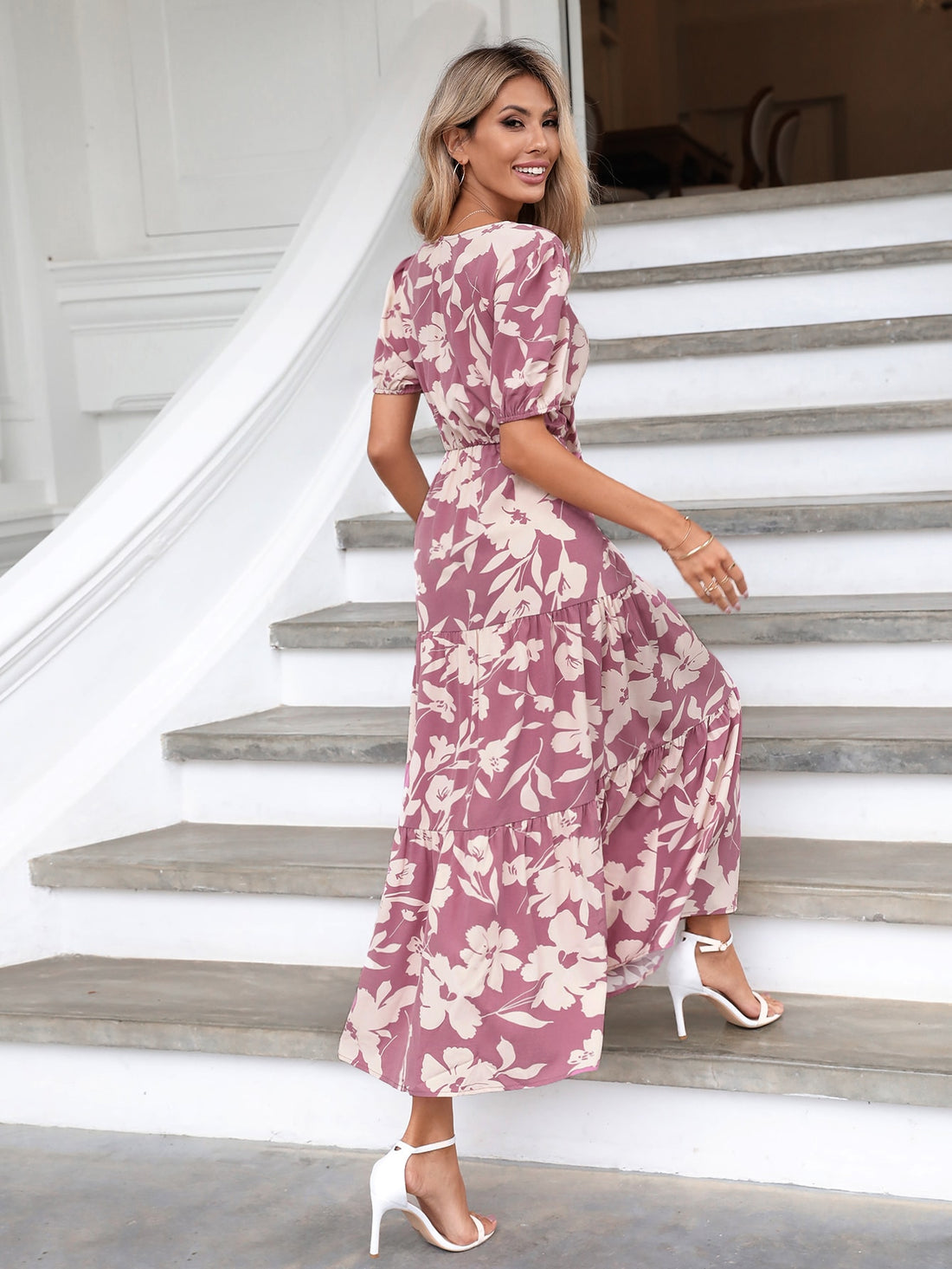 This dress is a whimsical mix of chic and fun. The twist front adds a touch of playful sophistication, while the cut-out and ruffle hem add a flirty edge. The floral pattern is the perfect finishing touch, making this dress a must-have for any stylish occasion.
