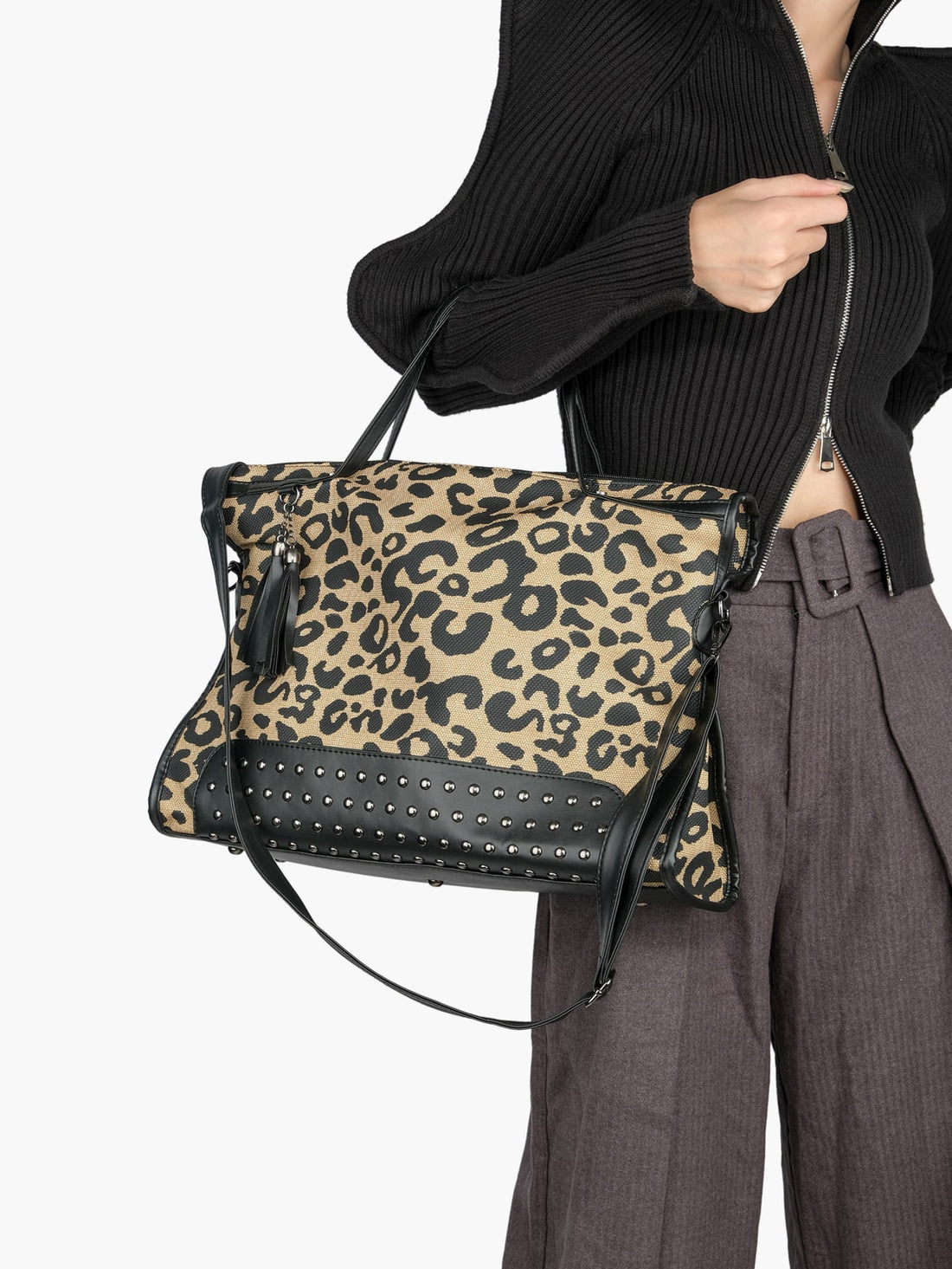 Elevate your style with our chic leopard studded shoulder tote bag - the perfect gift for trendy women and girlfriends. This stylish bag features bold leopard print, studded details, and a spacious design for all your essentials. Give the gift of fashion and functionality to the ones you love.