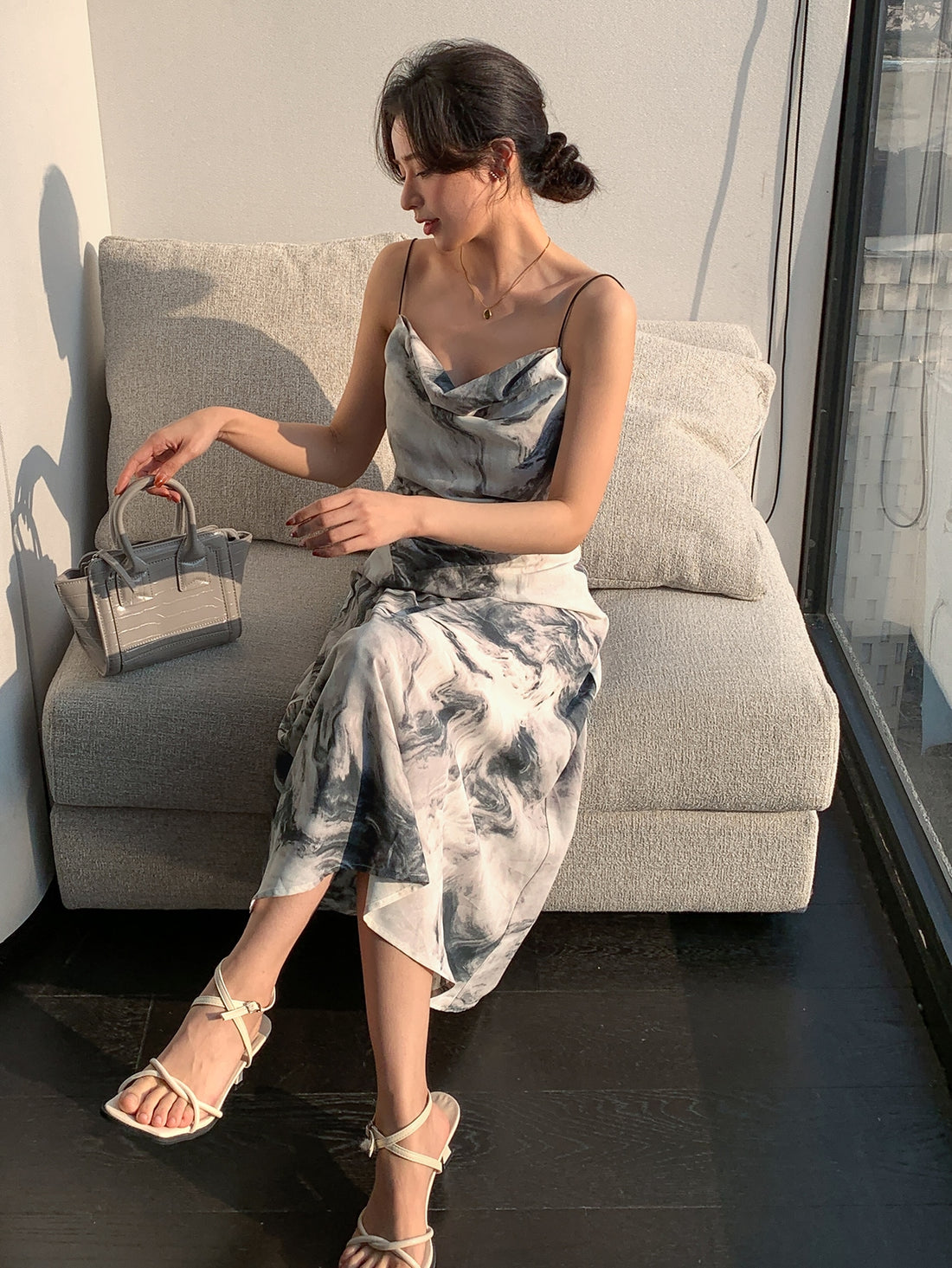 Slip into Effortless Elegance with our Stylish Allover Print Draped Collar Cami Dress! Perfect for every occasion, this dress features a unique allover print and a flattering draped collar. Step out in style and comfort with this must-have wardrobe staple.