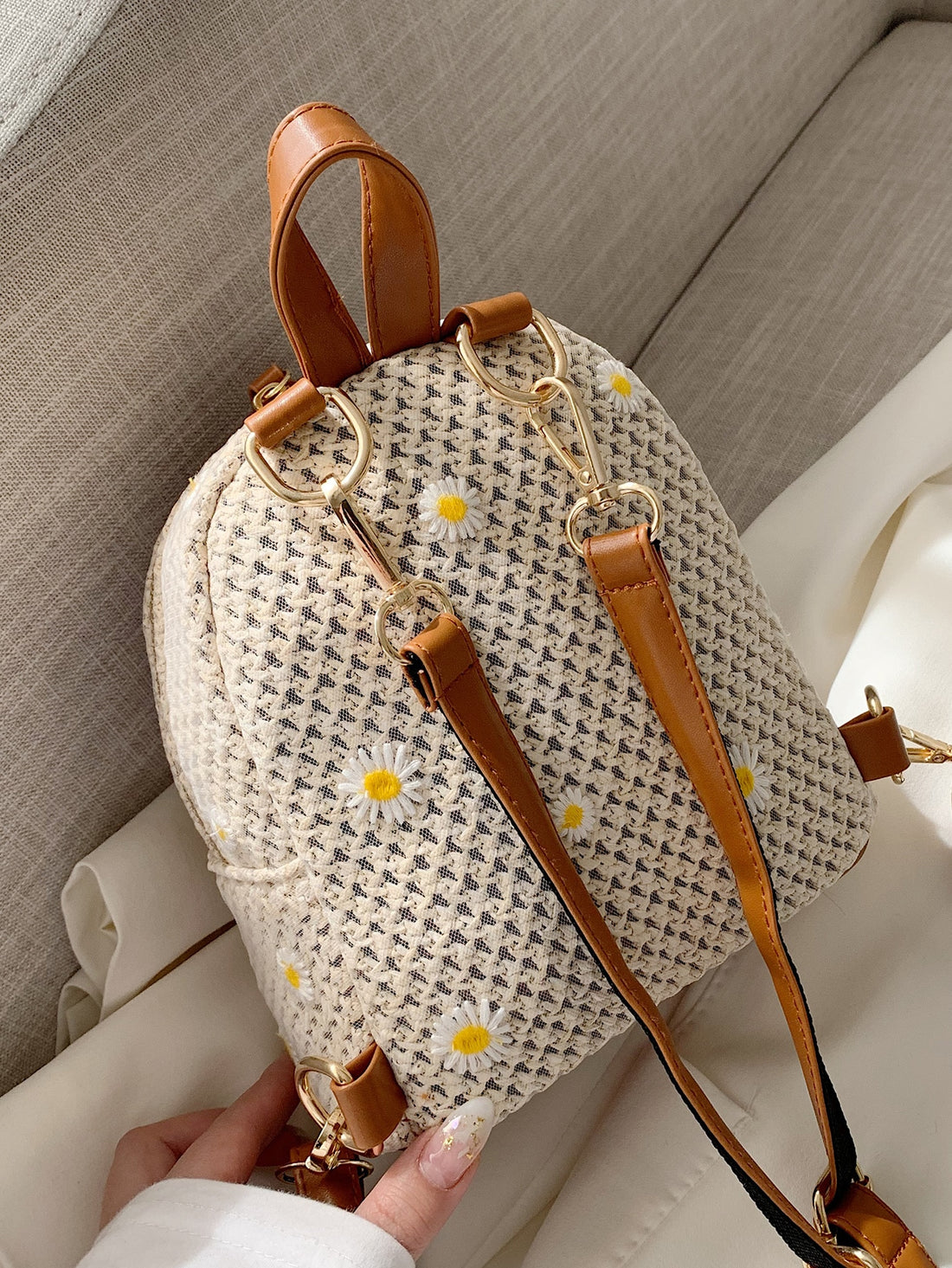 This Floral Embroidered Straw Backpack is the ultimate summer essential for every occasion. Its lightweight, breathable material is perfect for warm weather and the beautiful embroidered floral design adds a touch of elegance. With its spacious interior and comfortable straps, it's perfect for both practicality and style. 