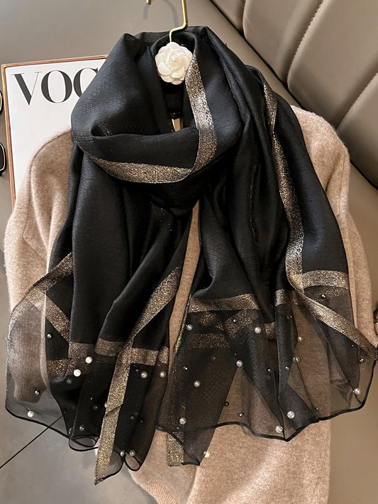 Elevate your style with Pearl Perfection: Women's Fashion Faux Pearl Decor Scarf. Made with high-quality materials, this scarf features a delicate faux pearl design, adding a touch of elegance to any outfit. The perfect accessory for any fashion-forward woman.
