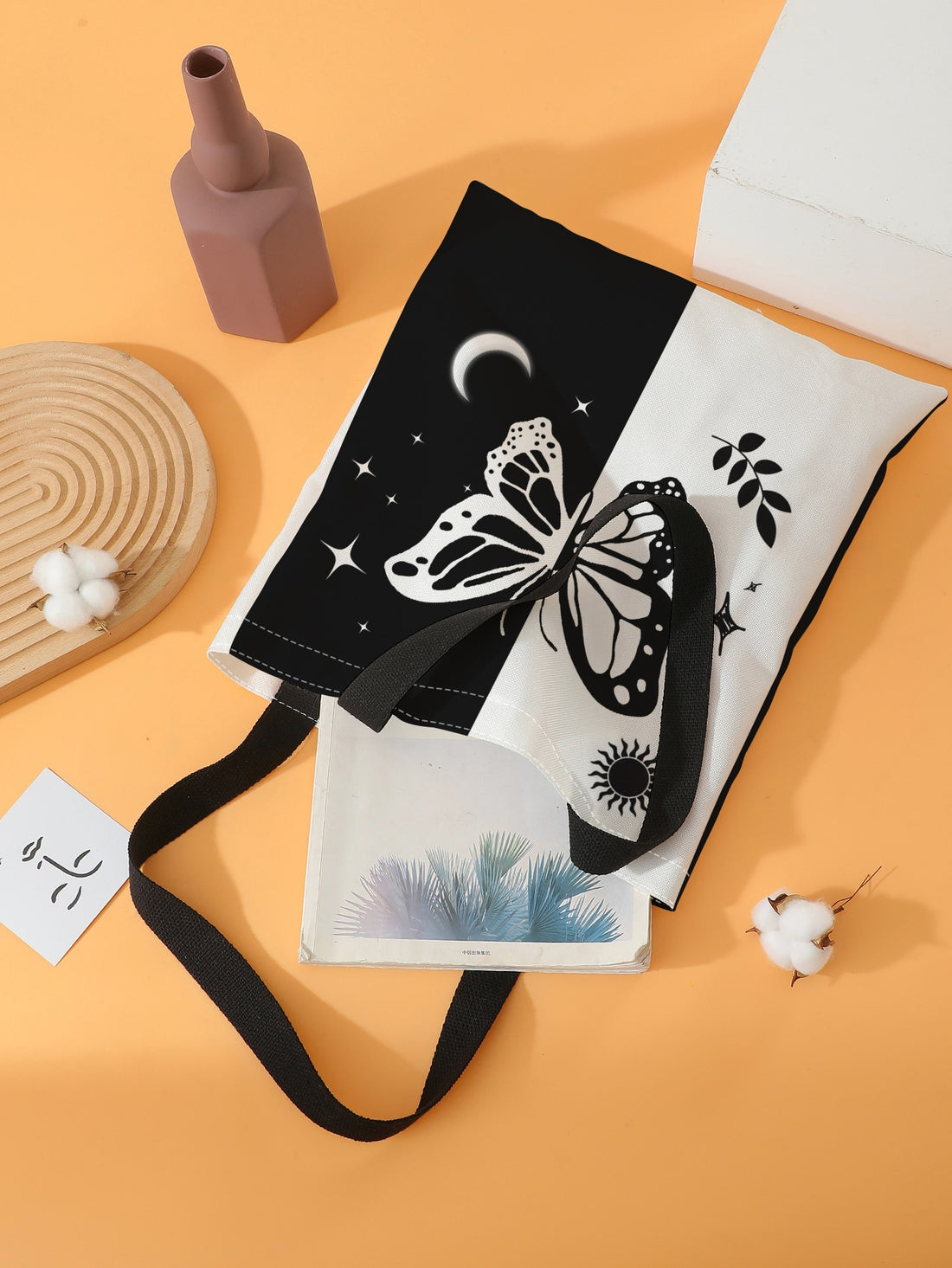 Unleash your inner butterfly with our Fluttering Wings Shopper Bag. This stylish and spacious bag is designed with fluttering butterfly wings on the sides, adding a unique touch to your ensemble. Made with durable materials, it's perfect for carrying all your essentials while on the go.