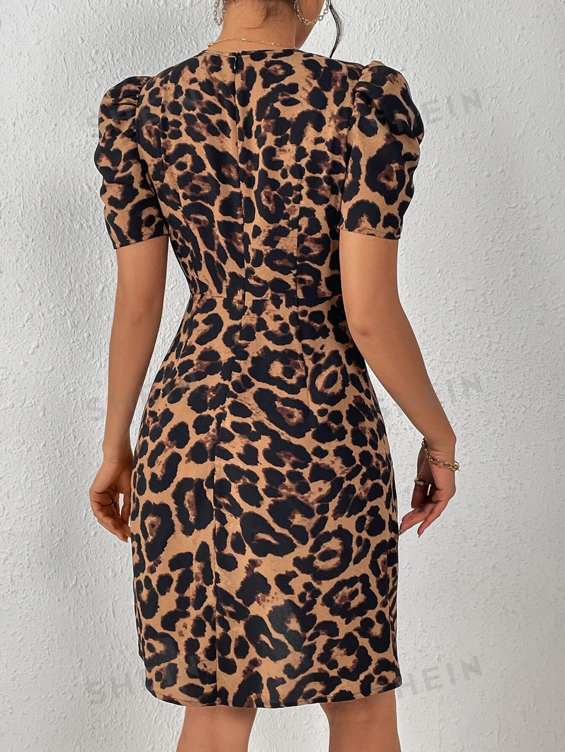 Add a touch of fierce elegance to your wardrobe with our Wild Elegance Leopard Print Puff Sleeve <a href="https://canaryhouze.com/collections/women-dresses" target="_blank" rel="noopener">Dress</a>. Featuring a trendy leopard print and stylish puff sleeves, this dress is sure to make a statement. Made with high-quality materials, it offers both comfort and style for any occasion.