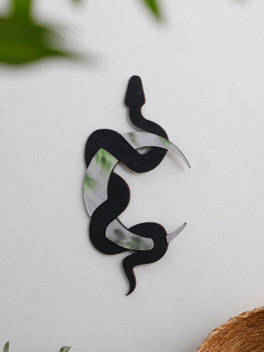 This striking Black Snake Shaped Wall Hanging Moon Decoration for Home adds a touch of unique charm to any room. Made with exquisite craftsmanship, this piece features a sleek black snake design that gracefully curves around a beautiful moon. Elevate your home decor with this eye-catching and elegant piece.