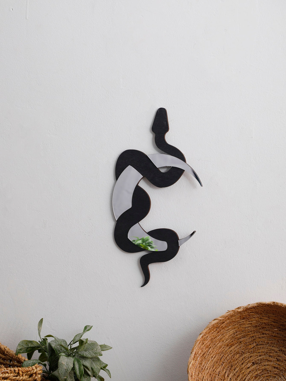 This striking Black Snake Shaped Wall Hanging Moon Decoration for Home adds a touch of unique charm to any room. Made with exquisite craftsmanship, this piece features a sleek black snake design that gracefully curves around a beautiful moon. Elevate your home decor with this eye-catching and elegant piece.