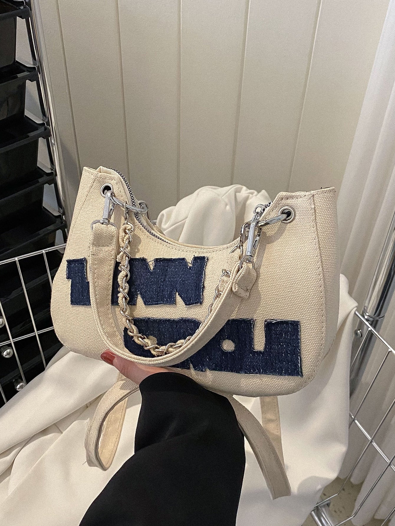 Introducing our Chic and Practical Chain Hobo Bag, perfect for the modern woman on the go. With its lightweight design and stylish chain embellishment, it's the perfect blend of fashion and function. Ideal for business casual settings, this bag is as versatile as it is chic. Expertly crafted for convenience, it's the perfect accessory for busy professionals.