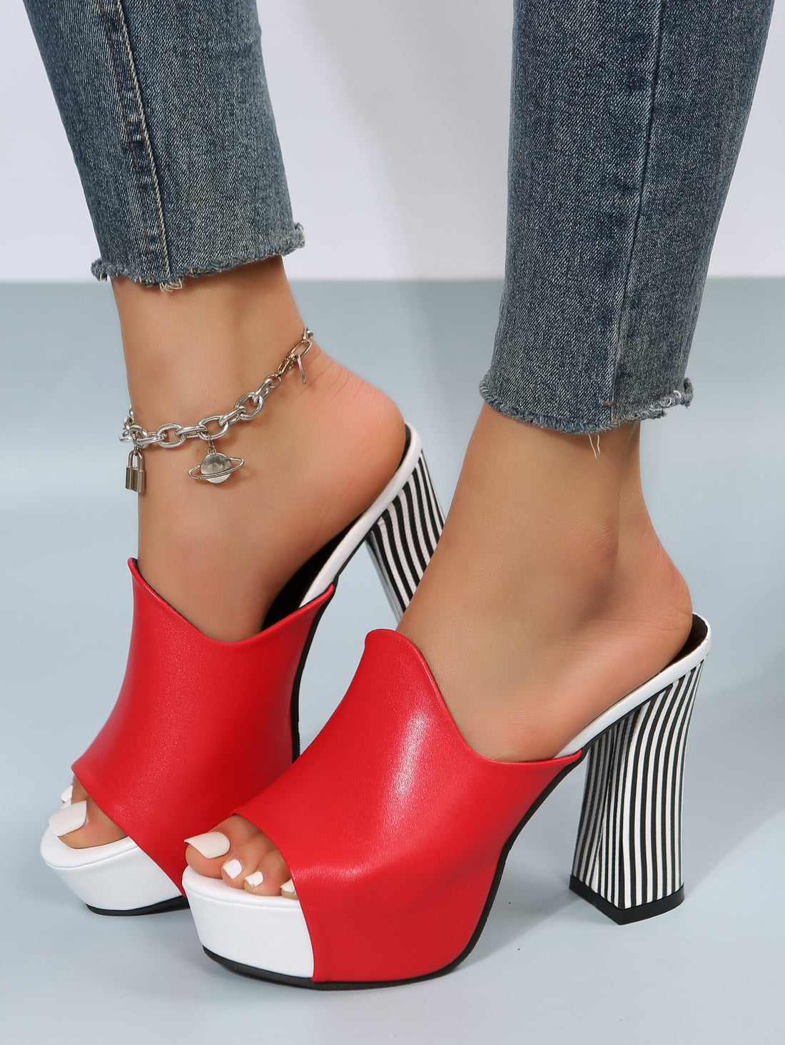 Elevate your fashion game with these Peep Toe Thick Sole High Heel Sandals for women. The chunky heel provides extra stability and support, while the open toe design adds a touch of chic. Perfect for any occasion, these sandals will add height and style to your outfit.