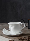 This modern porcelain <a href="https://canaryhouze.com/collections/mug" target="_blank" rel="noopener">mug</a> and saucer set features a stylish figure design, making it a beautiful and functional addition to any home. The sleek design adds a touch of elegance to your space while providing a durable and practical option for daily use. Update your kitchenware with this timeless set.