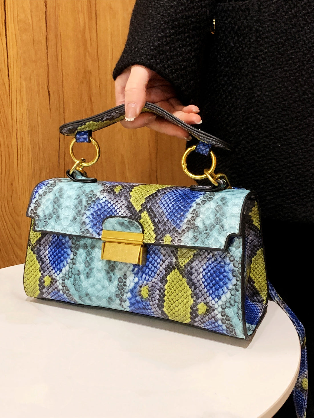 This sleek crossbody bag is the ultimate luxury for stylish women. Made with a versatile snake print design, it adds a touch of sophistication to any outfit. The spacious interior and adjustable strap make it a practical choice for everyday use. Elevate your fashion game with this must-have accessory.