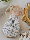 This adorable pet dress features a stylish plaid pattern and a bow decoration, adding a touch of cuteness to your furry friend's wardrobe. Made from high-quality materials, it provides both comfort and fashion. Perfect for any occasion, your pet will be the talk of the town.