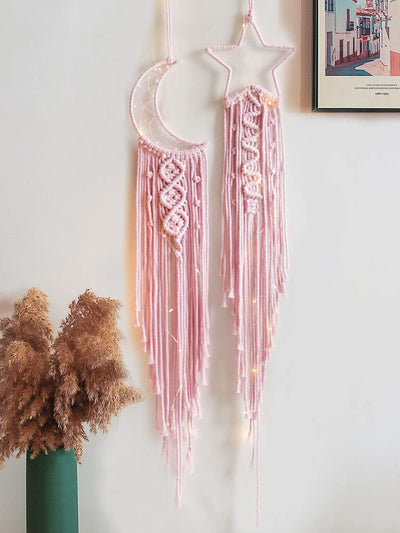 Add a touch of bohemian charm to your home decor with our Boho Pink Moon &amp; Star Wall Hanging Set. Made of durable polyester, this set features intricate moon and star designs that will liven up any room. Perfect for adding a unique touch to your space, this wall hanging set is a must-have for any boho lover.