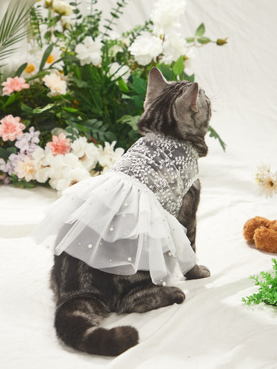 Dress your pet in style with our Elegant Lace Embroidered Pet Dress! Perfect for weddings and special occasions, this dress features intricate lace embroidery that will make your furry friend the center of attention. Give your pet the paw-fection they deserve.