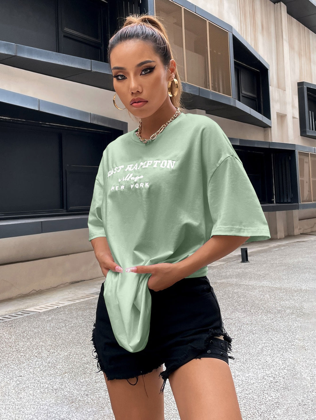 Introducing our expertly crafted Mint Green Drop Shoulder Letter Embroidery Top. Made with high-quality materials and a trendy drop shoulder design, this top exudes both style and comfort. The subtle letter embroidery adds a touch of sophistication. Ideal for any occasion, it's a must-have for any fashion-forward individual.