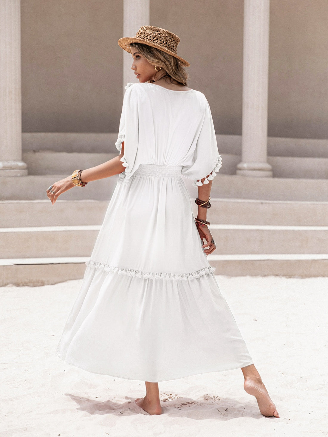 Introducing our Boho Chic Women's Tassel Trim Dress with Ruffle Hem. Perfect for any occasion, this dress features a stylish tassel trim and flowy ruffle hem. Stay on trend and comfortable with this unique piece.