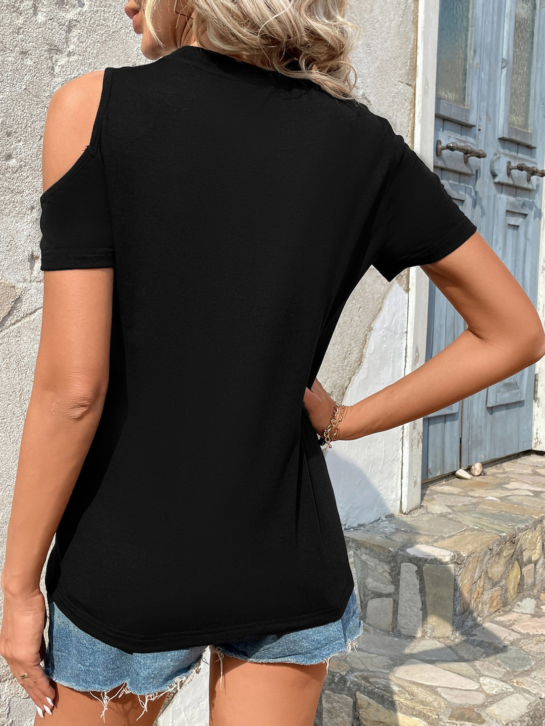 Elevate your summer style with our Chic Camo Cutout: Women's Summer Open Shoulder T-Shirt. Stay cool with cutout shoulders while making a statement with a trendy camo print. Expertly crafted for a comfortable, yet fashionable fit. Perfect for adding a touch of edge to any outfit.