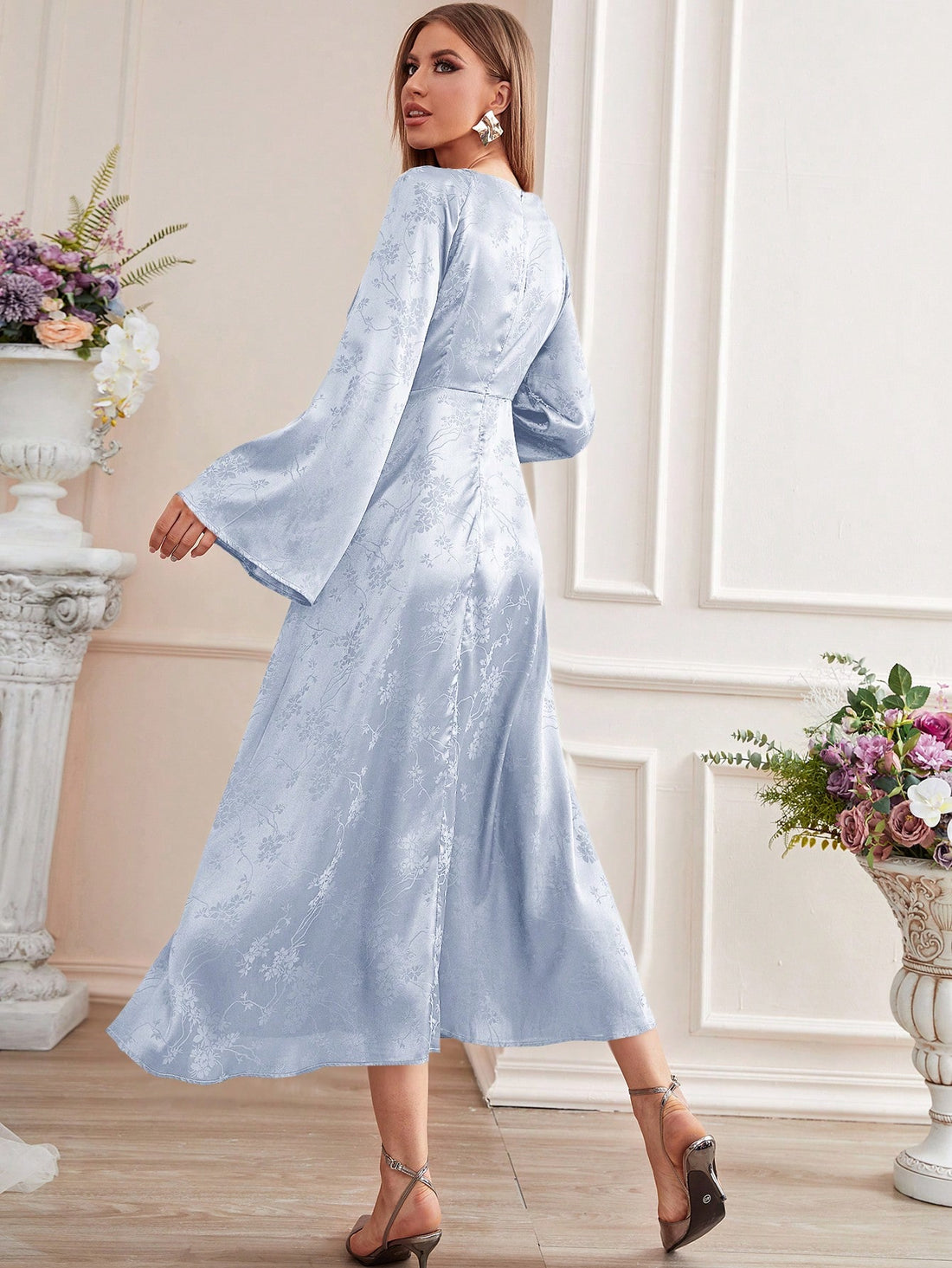 Expertly crafted with a stunning floral jacquard design, this Floral Fantasy dress boasts flounce sleeves and a luxurious satin fabric. Elevate your style with this elegant and feminine piece, perfect for special occasions.