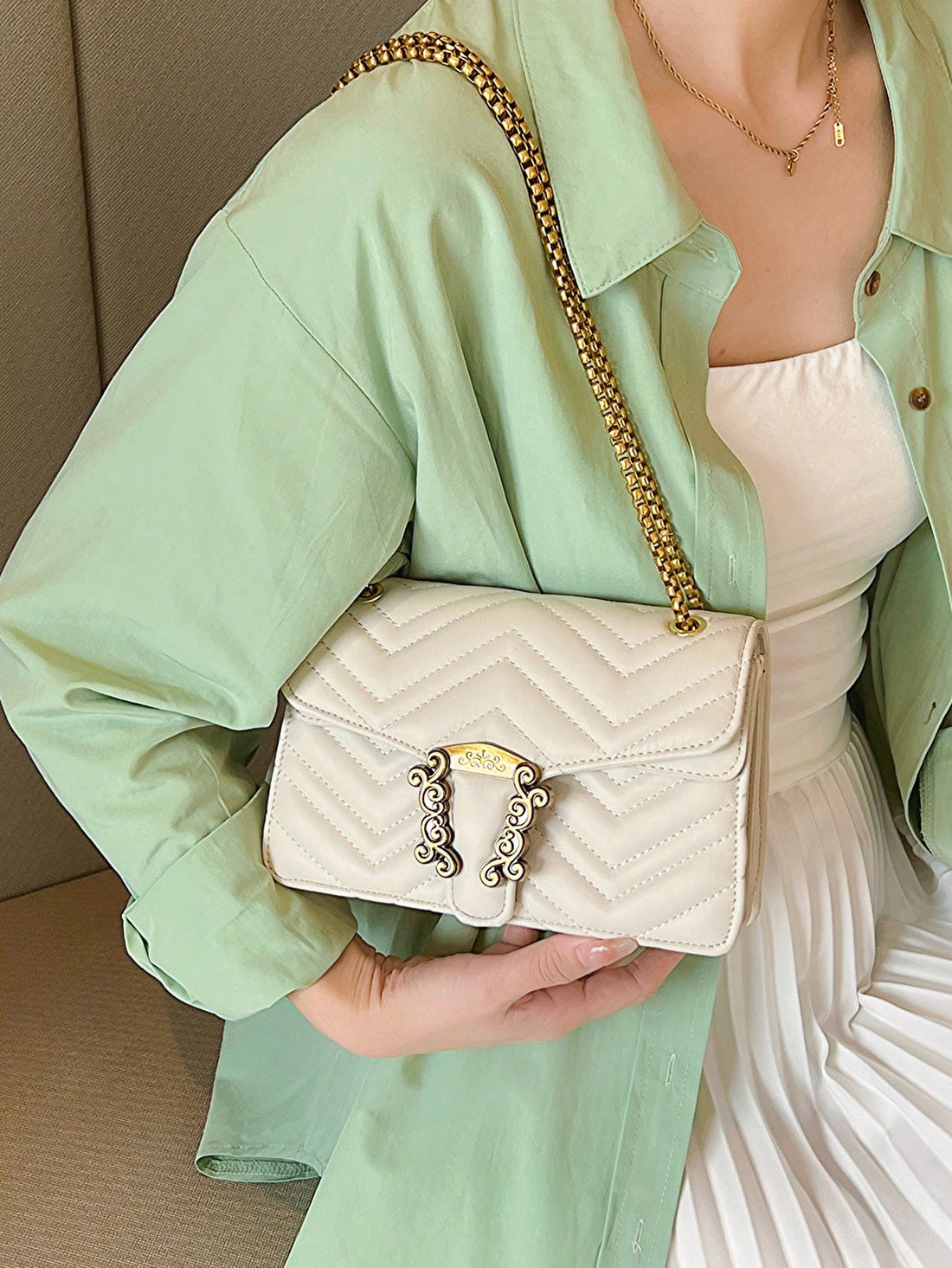 Experience chic and modern style with our Chevron Quilted Mini Bag. The metal accents and chain strap add a touch of luxury while the quilted design adds texture and dimension. Stay effortlessly stylish on-the-go with this must-have accessory.