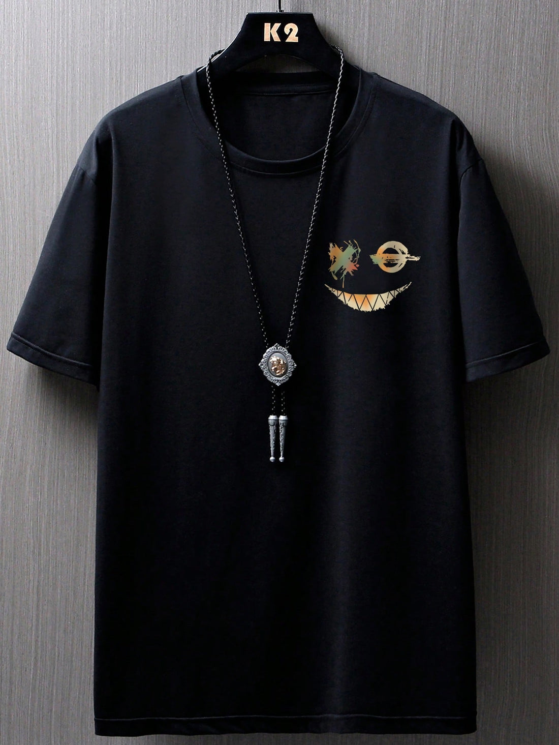 Get ready to add some sunshine to your wardrobe with our Smile Face Graphic Tee! This casual summer essential for men features a playful smiley face graphic, adding a touch of quirkiness to any outfit. Stay cool and stylish all season long.