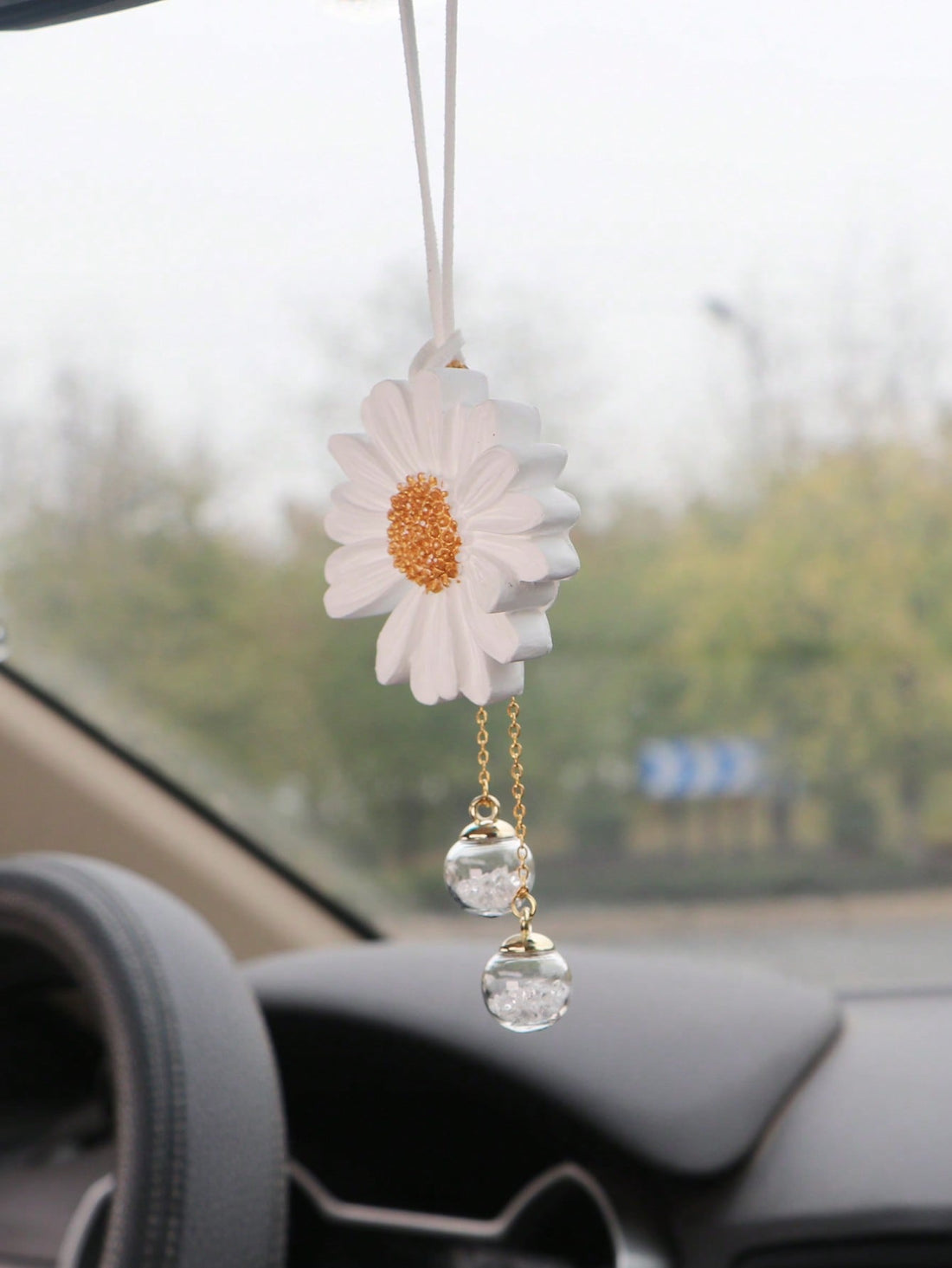 Add a touch of elegance and charm to your car with our Floral Beauty Hanging Ornament. The intricately designed flower adds a unique and beautiful touch to your vehicle, making every drive a pleasant experience. Made with quality materials, this ornament brightens up your car and complements your stylish personality.