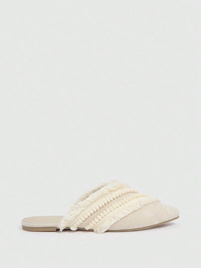 Bohemian Bliss: Beige Pom Pom Ruffle Flats for Vacation Chic