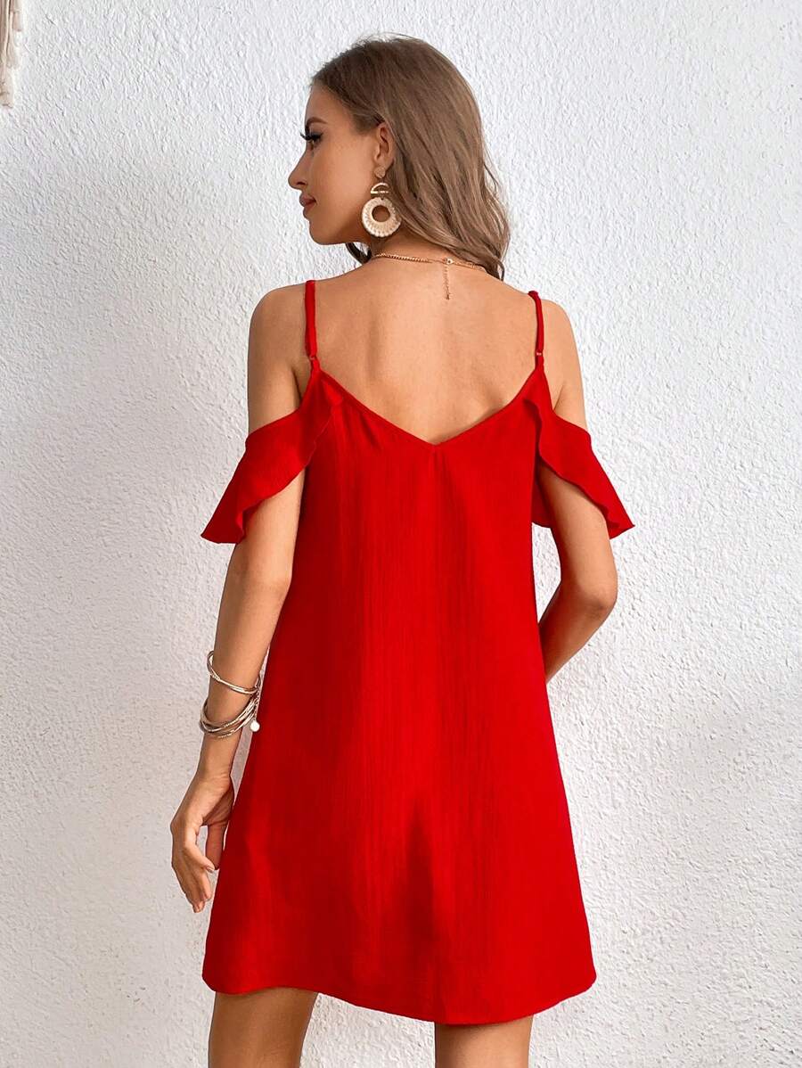 Back view of red cold shoulder mini dress with spaghetti straps