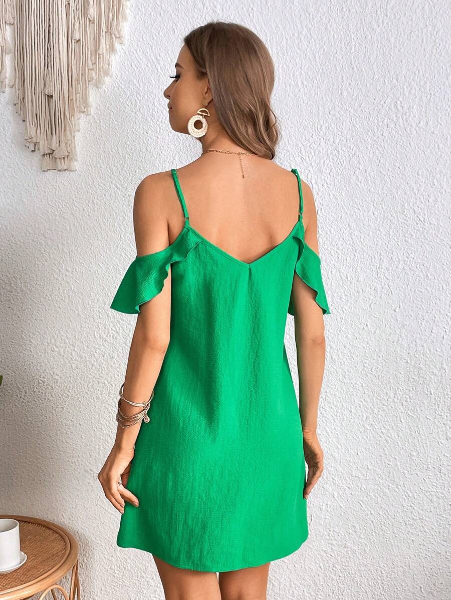 Back view of green cold shoulder mini dress with V-shaped back